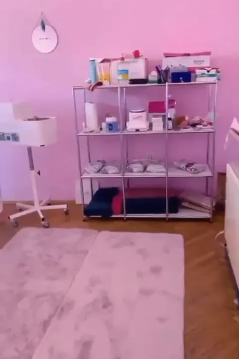 Shelf of waxing and beauty products in the pink treatment room